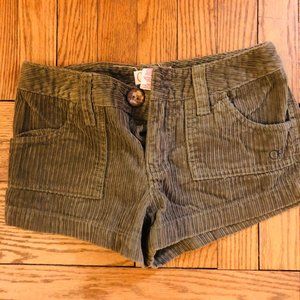 Green colored jean shorts